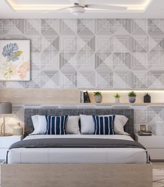 bedroom-with-a-geometric-wallpaper-and-bed-with-cushioned-headboard-in-1-bhk-flat-design